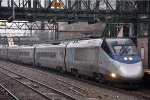 Acela Express cruises west through the station